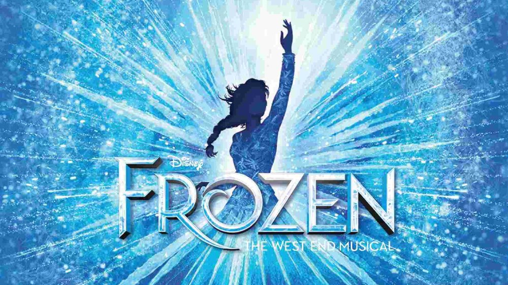 Blue promotional artwork for Disney’s Frozen: The West End Musical, featuring a silhouetted figure reaching upward against a burst of icy light and snowflake patterns.