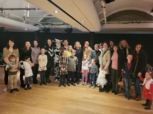 Picture shows women and children from the Ukrainian British Friendship group in Huddersfield, meeting pantomime characters at Lawrence Batley Theatre