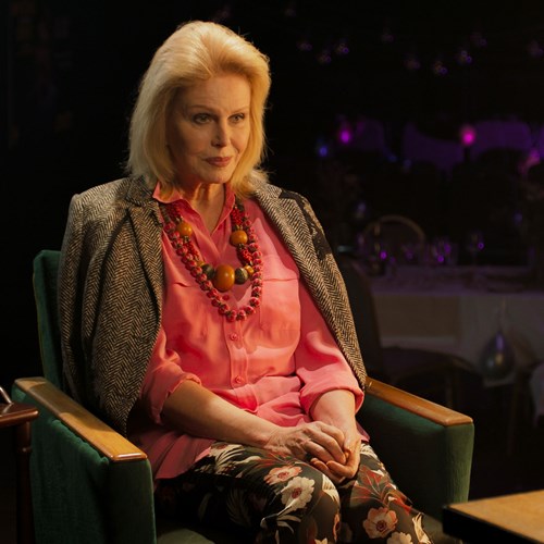 A photograph of actress Joanna Lumley dressed smartly, performing in The Picture of Dorian Gray