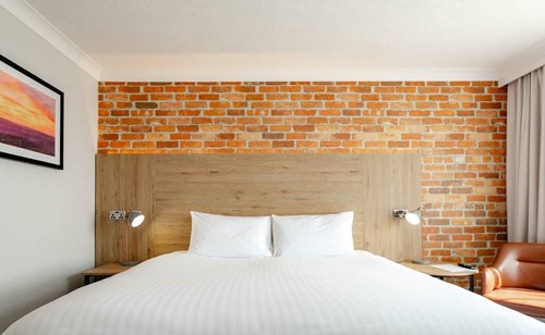 Image of bed with white sheets