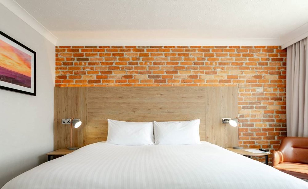 Image of bed with white sheets