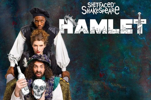 Promotional image for 'Sh!tfaced Shakespeare: Hamlet' featuring three performers in Shakespearean costumes. The front actor holds a bottle and a skull with a humorous expression, while the two behind have exaggerated serious looks. The title 'HAMLET' is displayed in bold white letters with sword and dagger elements against a textured blue-green background