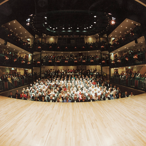 A photograph taken on stage of a full audience on the opening night of the theatre in 1994.