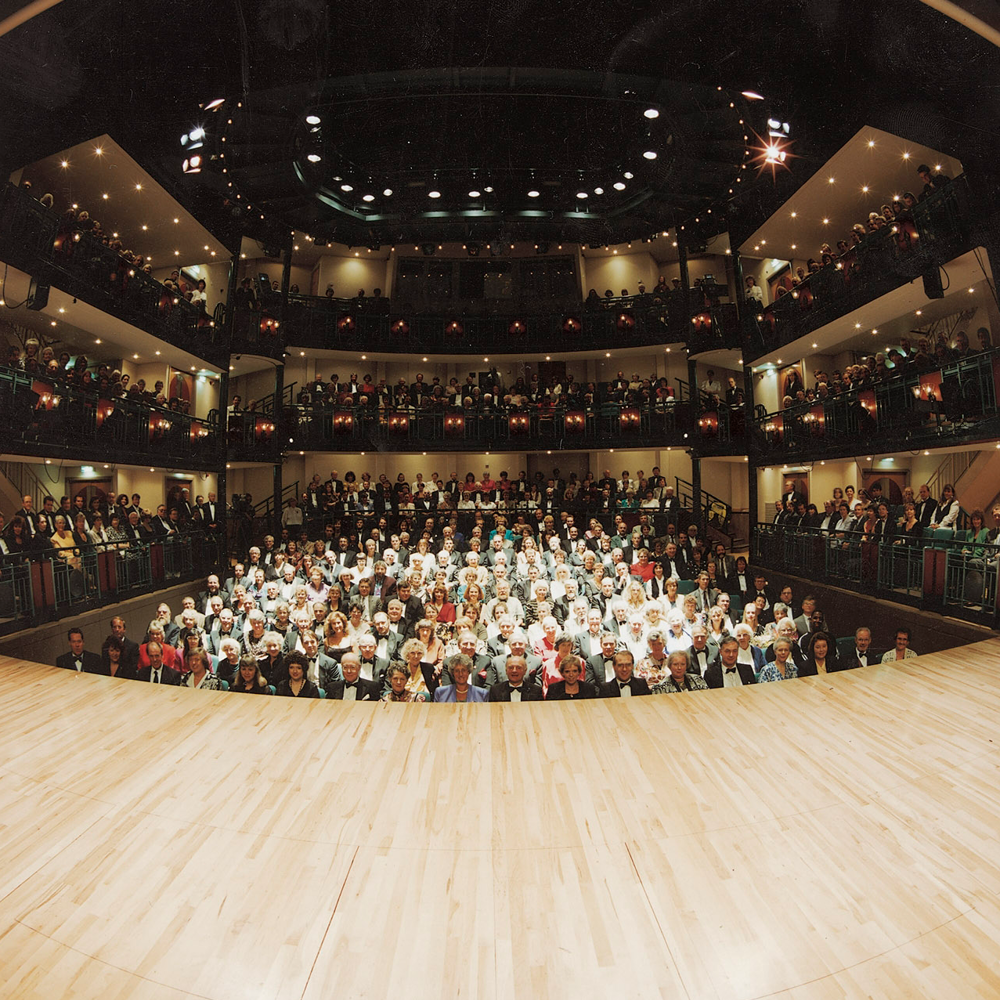 A photograph taken on stage of a full audience on the opening night of the theatre in 1994.