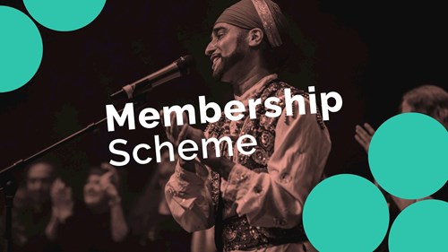 A man applauding on stage in front of microphone, with text over the image saying Membership Scheme