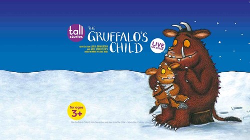 Illustration artwork of The Gruffalo's child with the title in white lettering, on a blue background. There is also snow in the image and the Gruffalo sits on a tree stump with his child on his lap. 