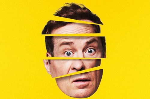 The image shows a man’s face against a bright yellow background, divided horizontally into multiple slices, with each slice slightly misaligned from the others. The man has an expressive, surprised look with wide eyes and a raised eyebrow, conveying a sense of shock or confusion. The overall design creates a fragmented, surreal visual effect, as though his face is being separated or distorted. The yellow background adds a bold, vibrant contrast to the facial expression.