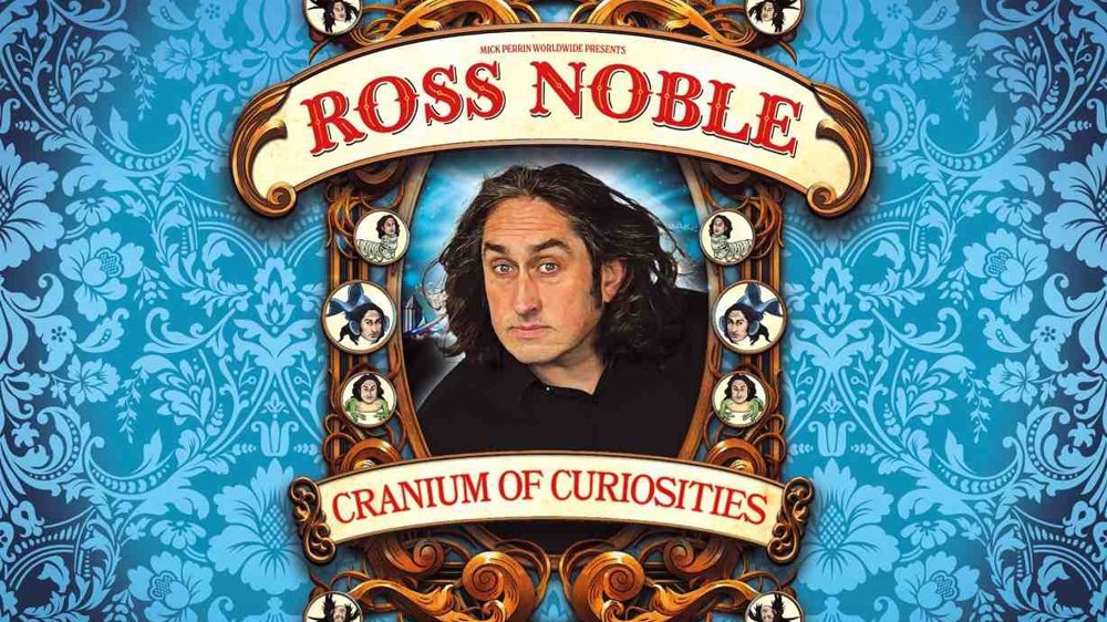 Promotional poster for “Ross Noble: Cranium of Curiosities.” Comedian Ross Noble is pictured in an ornate oval frame against a bright blue patterned wallpaper background. Decorative vintage-style scrollwork surrounds the portrait, with the show title in large red lettering on curved banners above and below the image. Small illustrated portraits and theatrical details decorate the frame, giving the poster a whimsical Victorian circus aesthetic.