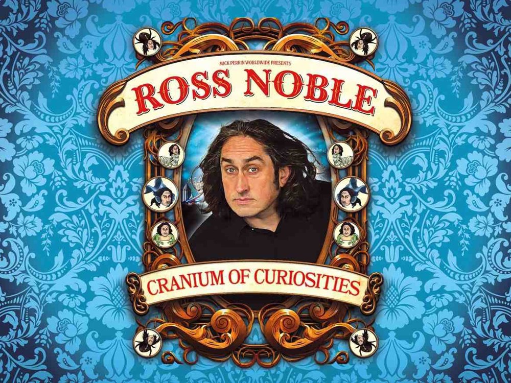 Promotional poster for “Ross Noble: Cranium of Curiosities.” Comedian Ross Noble is pictured in an ornate oval frame against a bright blue patterned wallpaper background. Decorative vintage-style scrollwork surrounds the portrait, with the show title in large red lettering on curved banners above and below the image. Small illustrated portraits and theatrical details decorate the frame, giving the poster a whimsical Victorian circus aesthetic.