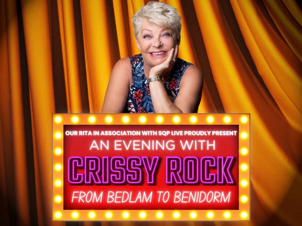 A promotional image for “An Evening with Crissy Rock: From Bedlam to Benidorm.” Comedian Crissy Rock is smiling with her chin resting on her hand, in front of a golden theatre curtain. The event title is displayed below her in bright lights with bold, colourful text.