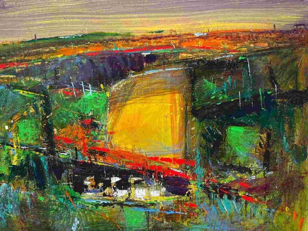 An expressive landscape painting by Neville Fleetwood, depicting a patchwork of colourful farmland. A glowing yellow rapeseed field dominates the centre, surrounded by rich greens, reds, and browns. A small village with white buildings rests near the bottom edge, while a hazy blue sky stretches above. The scene is dynamic and atmospheric, rendered in energetic, layered strokes.