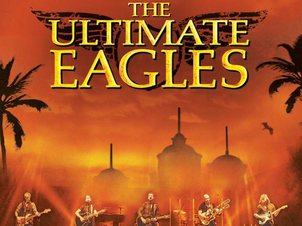 Promotional poster for The Ultimate Eagles, featuring the band performing on stage against a warm orange sunset background with silhouettes of palm trees and domed rooftops.