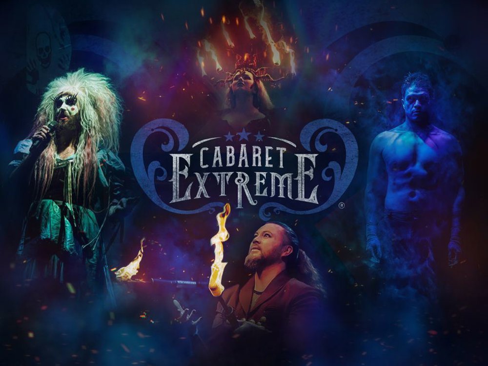 Promotional poster for ‘Cabaret Extreme’ featuring dramatic, theatrical performers. On the left, a performer in wild makeup and a tattered green dress sings into a microphone. At the top centre, a woman wears a flaming candelabra on her head. Below her, a man breathes fire. On the right, a shirtless male performer stands in blue light. The show’s title ‘Cabaret Extreme’ appears in ornate lettering at the centre.