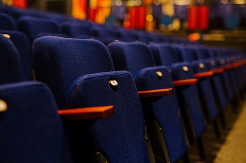 a row of blue flip down seats